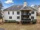 Rear exterior of home with multi-level deck and balcony, set in a lush yard at 1007 Fairway Seven, Villa Rica, GA 30180