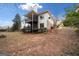 Rear exterior of home with multi-level deck and balcony, set in a lush yard at 1007 Fairway Seven, Villa Rica, GA 30180