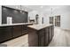 Spacious kitchen with dark cabinets, granite counters, and center island at 1007 Fairway Seven, Villa Rica, GA 30180