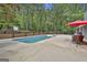 Beautiful backyard featuring an in-ground pool, patio, and lush greenery for relaxation at 125 Wendell Ct, Fayetteville, GA 30215