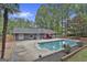 The large backyard includes a swimming pool, patio, and manicured landscaping at 125 Wendell Ct, Fayetteville, GA 30215