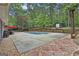 Spacious backyard with an in-ground pool, patio, and lush landscaping provides an ideal outdoor oasis for relaxation at 125 Wendell Ct, Fayetteville, GA 30215