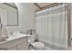 Bathroom featuring a shower with a striped curtain, a modern toilet, and vanity at 125 Wendell Ct, Fayetteville, GA 30215