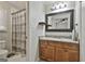 The bathroom offers a granite sink and shower featuring a patterned shower curtain at 125 Wendell Ct, Fayetteville, GA 30215