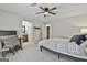 A bedroom featuring a ceiling fan, a work desk, and ensuite bath at 125 Wendell Ct, Fayetteville, GA 30215