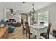 Formal dining room with wood floors, chandelier, and view into living space at 125 Wendell Ct, Fayetteville, GA 30215