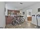 Home gym area with exercise equipment and pass-through into the kitchen at 125 Wendell Ct, Fayetteville, GA 30215