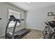 Home exercise room with treadmill, bikes, and neutral wall color at 125 Wendell Ct, Fayetteville, GA 30215