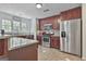 This kitchen features stainless steel appliances, granite countertops, and dark wood cabinetry at 125 Wendell Ct, Fayetteville, GA 30215