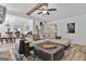 Comfortable sectional couch with oversized ottoman and view of dining area at 125 Wendell Ct, Fayetteville, GA 30215