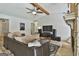 Spacious living room with stone fireplace, comfortable sectional sofa, and entertainment center at 125 Wendell Ct, Fayetteville, GA 30215