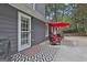 Inviting patio area featuring a red umbrella and outdoor seating, perfect for relaxation and entertaining guests at 125 Wendell Ct, Fayetteville, GA 30215