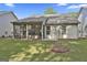 Backyard showcasing a screened porch area for outdoor enjoyment at 430 Silverbell Ct, Peachtree City, GA 30269