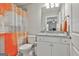 Bathroom with a granite vanity, brushed nickel faucet, and orange shower curtain at 430 Silverbell Ct, Peachtree City, GA 30269