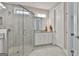 Well-lit bathroom showcasing a glass-enclosed shower, granite counters and dual sinks at 430 Silverbell Ct, Peachtree City, GA 30269
