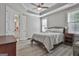 Bright bedroom with trey ceiling, natural light, and an ensuite bathroom at 430 Silverbell Ct, Peachtree City, GA 30269