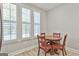 Cozy breakfast nook featuring a round table, bright window, and wood flooring at 430 Silverbell Ct, Peachtree City, GA 30269