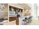 A stylish clubhouse bar features modern design elements and is fully equipped for entertaining at 430 Silverbell Ct, Peachtree City, GA 30269