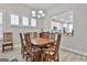 Dining room features wood floors and lots of natural light from bright windows at 430 Silverbell Ct, Peachtree City, GA 30269
