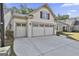 Spacious three-car garage with ample driveway space in front of the charming one-story home at 430 Silverbell Ct, Peachtree City, GA 30269
