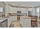 Bright kitchen with stainless steel appliances, granite countertops, and ample storage at 430 Silverbell Ct, Peachtree City, GA 30269