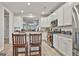 Bright kitchen featuring white cabinets, stainless steel appliances, and granite countertops at 430 Silverbell Ct, Peachtree City, GA 30269