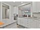 Updated kitchen features white cabinets, stainless appliances, and granite countertops at 430 Silverbell Ct, Peachtree City, GA 30269