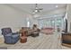 Cozy living room featuring plush furniture, neutral walls, and wood flooring at 430 Silverbell Ct, Peachtree City, GA 30269