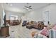 Spacious living room with an open floor plan, wood-look flooring, and cozy seating at 430 Silverbell Ct, Peachtree City, GA 30269