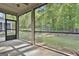 Screened porch overlooking a lush, green backyard at 430 Silverbell Ct, Peachtree City, GA 30269