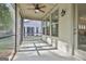 Covered screened porch with ceiling fan and outdoor lighting at 430 Silverbell Ct, Peachtree City, GA 30269