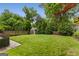 Well-maintained backyard featuring a storage shed and lush landscaping with privacy at 239 Kings Hwy, Decatur, GA 30030