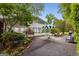 Backyard featuring a paved section, green umbrella, and view of the indoor pool area at 239 Kings Hwy, Decatur, GA 30030