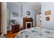 Bedroom with period fireplace, hardwood flooring, and lots of natural light at 239 Kings Hwy, Decatur, GA 30030
