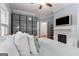Bright bedroom featuring blue walls, a ceiling fan, and fireplace at 239 Kings Hwy, Decatur, GA 30030