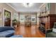 Open dining room with hardwood floors, fireplace, and natural light at 239 Kings Hwy, Decatur, GA 30030