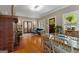 Well-lit dining area with hardwood floors and access to the living room at 239 Kings Hwy, Decatur, GA 30030