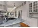 Well-lit kitchen with stainless appliances, hardwood floors, and white cabinets with glass doors at 239 Kings Hwy, Decatur, GA 30030