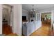 Open-concept living room with hardwood floors, an adjacent dining room, and a gray sofa at 239 Kings Hwy, Decatur, GA 30030