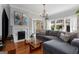 Cozy living room with a fireplace, gray sectional sofa, and hardwood floors at 239 Kings Hwy, Decatur, GA 30030