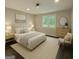 Bright bedroom featuring a queen-sized bed, neutral decor, and plenty of natural light at 2851 Headland Dr, East Point, GA 30344
