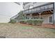 Spacious backyard featuring a deck above, a tiered yard, and lush landscaping at 112 Windalier Rdg, Peachtree City, GA 30269