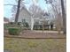 Large backyard and deck of a home surrounded by trees and greenery at 112 Windalier Rdg, Peachtree City, GA 30269