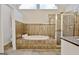 Bathroom with a large soaking tub and a separate glass-enclosed shower at 112 Windalier Rdg, Peachtree City, GA 30269