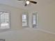 Bright bedroom with neutral carpeting, ample natural light, and doorway to an adjacent room at 112 Windalier Rdg, Peachtree City, GA 30269