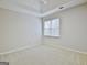 Bedroom with neutral walls, plush carpet, and a window with lots of natural light at 112 Windalier Rdg, Peachtree City, GA 30269