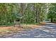 Community entrance to Blue Smoke Parks & Recreation featuring lush trees and a paved road at 112 Windalier Rdg, Peachtree City, GA 30269