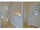 Bright entryway features hardwood floors, a staircase, and a view into the adjacent living spaces at 112 Windalier Rdg, Peachtree City, GA 30269