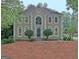 Charming two-story home showcasing a symmetrical facade and inviting entryway at 112 Windalier Rdg, Peachtree City, GA 30269