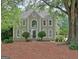 Traditional two-story home boasting well-manicured landscaping and classic architectural details at 112 Windalier Rdg, Peachtree City, GA 30269